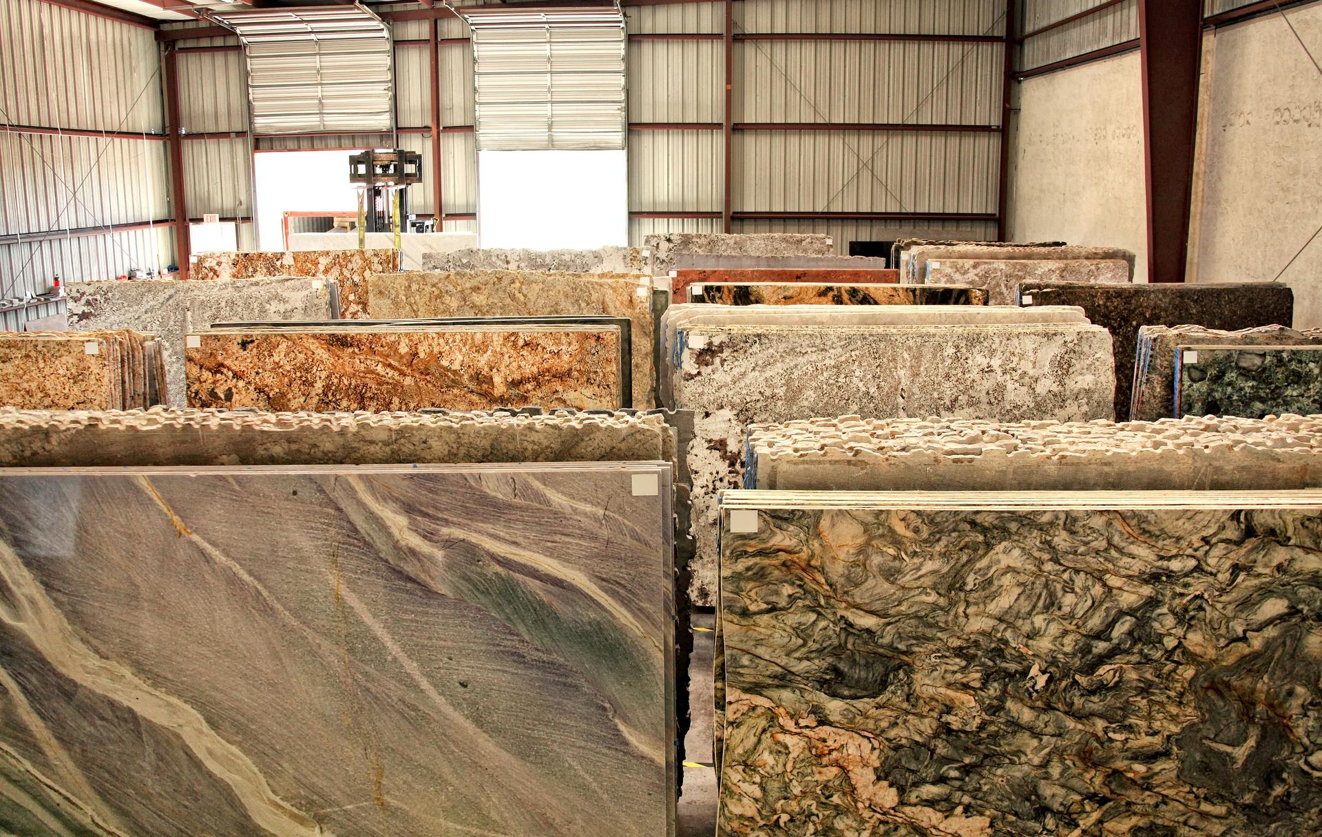 Various granite slabs at construction material store warehouse